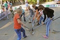 Children playing street hockey on a city holiday in Volgograd