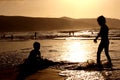 Children Playing on Sunset Beach Royalty Free Stock Photo