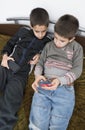 Children playing with their smartphones.