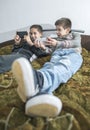 Children playing with their smartphones.