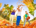 Children playing with thrown leaves in the forest Royalty Free Stock Photo