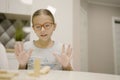 Children playing Jenga tower to remove wooden blocks at home. two girls and boy having fun together - board game and kids leisure Royalty Free Stock Photo