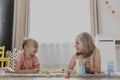 Children playing with toy building blocks on the floor at home or kindergarten Royalty Free Stock Photo