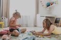 Children playing with toy building blocks on the floor at home or kindergarten Royalty Free Stock Photo