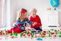 Children playing with toy railroad and train Royalty Free Stock Photo