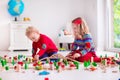 Children playing with toy railroad and train Royalty Free Stock Photo