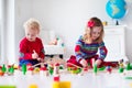 Children playing with toy railroad and train Royalty Free Stock Photo