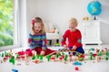 Children playing with toy railroad and train Royalty Free Stock Photo