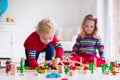 Children playing with toy railroad and train Royalty Free Stock Photo