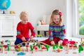 Children playing with toy railroad and train Royalty Free Stock Photo