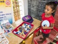 Children playing with toys balloon on the floor of the children`s room. Kindergarten educational games in India Royalty Free Stock Photo