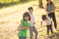 Children playing tug of war at the park on sunsut Royalty Free Stock Photo