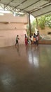 Children playing under the roof of temple