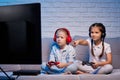 children playing video game with game console Royalty Free Stock Photo