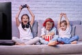 children playing video game with game console Royalty Free Stock Photo