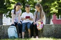 Children playing video games outdoors Royalty Free Stock Photo