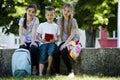 Children playing video games outdoors Royalty Free Stock Photo