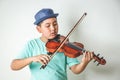 Children playing violin instruments in the classroom Royalty Free Stock Photo