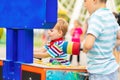 Children playing whack a mole arcade game at an amusement park Royalty Free Stock Photo