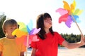 Children playing with windmill Royalty Free Stock Photo