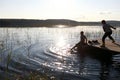 Children playing on wooden bridge by lake Royalty Free Stock Photo