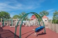Children playing at wooden playground recreation area in American public park Royalty Free Stock Photo