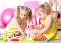 Children playing wooden toys at home Royalty Free Stock Photo