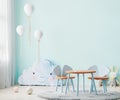 Children playroom with blue wall and kids table, children room interior mock up with soft toys and balloons, 3d rendering Royalty Free Stock Photo