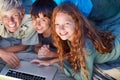 Children, portrait and relax with laptop on floor together with happiness and online games for holiday or vacation. Kids Royalty Free Stock Photo