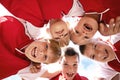Children, portrait and soccer team huddle or support, happy and collaboration in outdoors. Below, kids and boys together Royalty Free Stock Photo