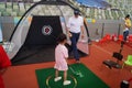 Children practice golf