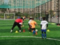 Shenzhen, China: children train to play soccer during winter vacation