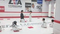 The children practice Taekwondo in the professional Taekwondo Hall under the guidance of the coach