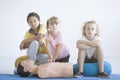 Children practicing chest compressions Royalty Free Stock Photo