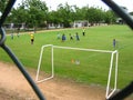 Children practicing soccer on a court in Puerto Ordaz city, Venezuela