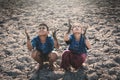 Children praying for the rain on lake