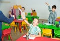 Children pull their hands to answer teacher question in the school class Royalty Free Stock Photo