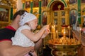 Children put a candle in the church. Epiphany Cathedral. Decoration of the temple. The Nile desert. Nilo-Stolobenskaya desert. Tve