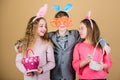 Children in rabbit bunny ears. Happy easter. Spring holiday party. Egg hunt. Family and sisterhood. Little girls and boy Royalty Free Stock Photo