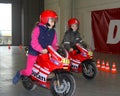 The children with the racing motorcycles