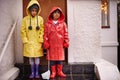 Children, raincoat and portrait on porch for unhappy, cold weather and growing up for adolescent and innocent. Kids or