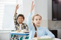 Children Raising Hands in School Royalty Free Stock Photo