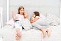 Children read book in bed. Reading before bed can help sleep better at night. Stories every kid should read. Family Royalty Free Stock Photo