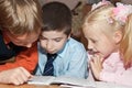 Children reading a book Royalty Free Stock Photo