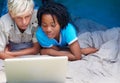 Children, relax and watch laptop on bed together with cartoon, movie or online games on holiday or vacation. Kids, smile Royalty Free Stock Photo