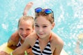 Children rest in the pool in summer