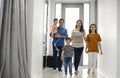 Children returning home with parents mom and dad, smiling cute children brother and sisters