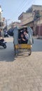 Children in a rickshaw posture after being discharged from school.