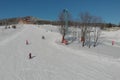 Children ride for adults skier in ski resort Royalty Free Stock Photo