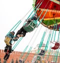 Children ride on the carousel in the park Royalty Free Stock Photo